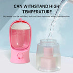 Pink heat-resistant pet water dispenser with clear reservoir and safe hot water feature