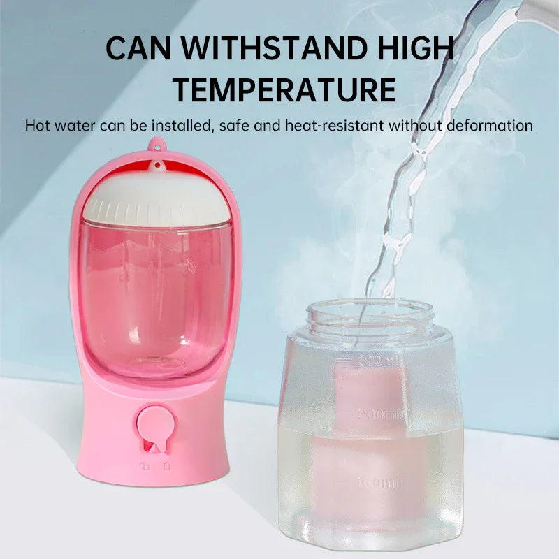 Pink heat-resistant pet water dispenser with clear reservoir and safe hot water feature