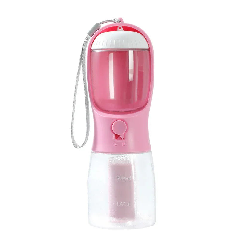 Pink portable pet water bottle with built-in bowl and carry strap for dogs on the go
