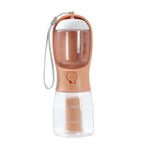 Portable dog water bottle with built-in bowl, 300ml capacity, peach and clear design, perfect for travel